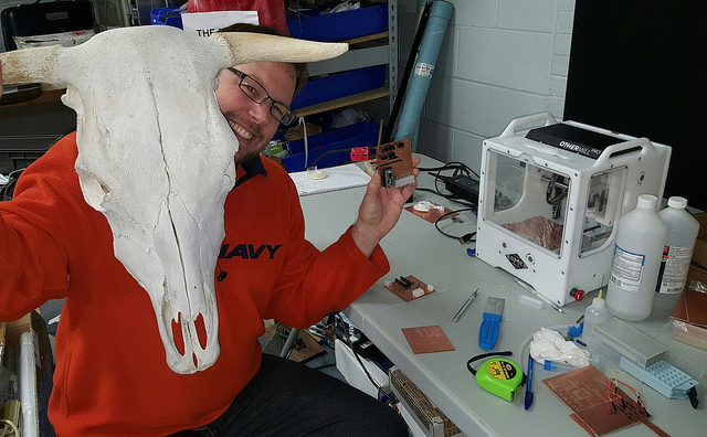 Audubon Community Nature Center collaborates with Steve French, shown here creating custom circuit boards at Volt Vision while working on Winter Lights.